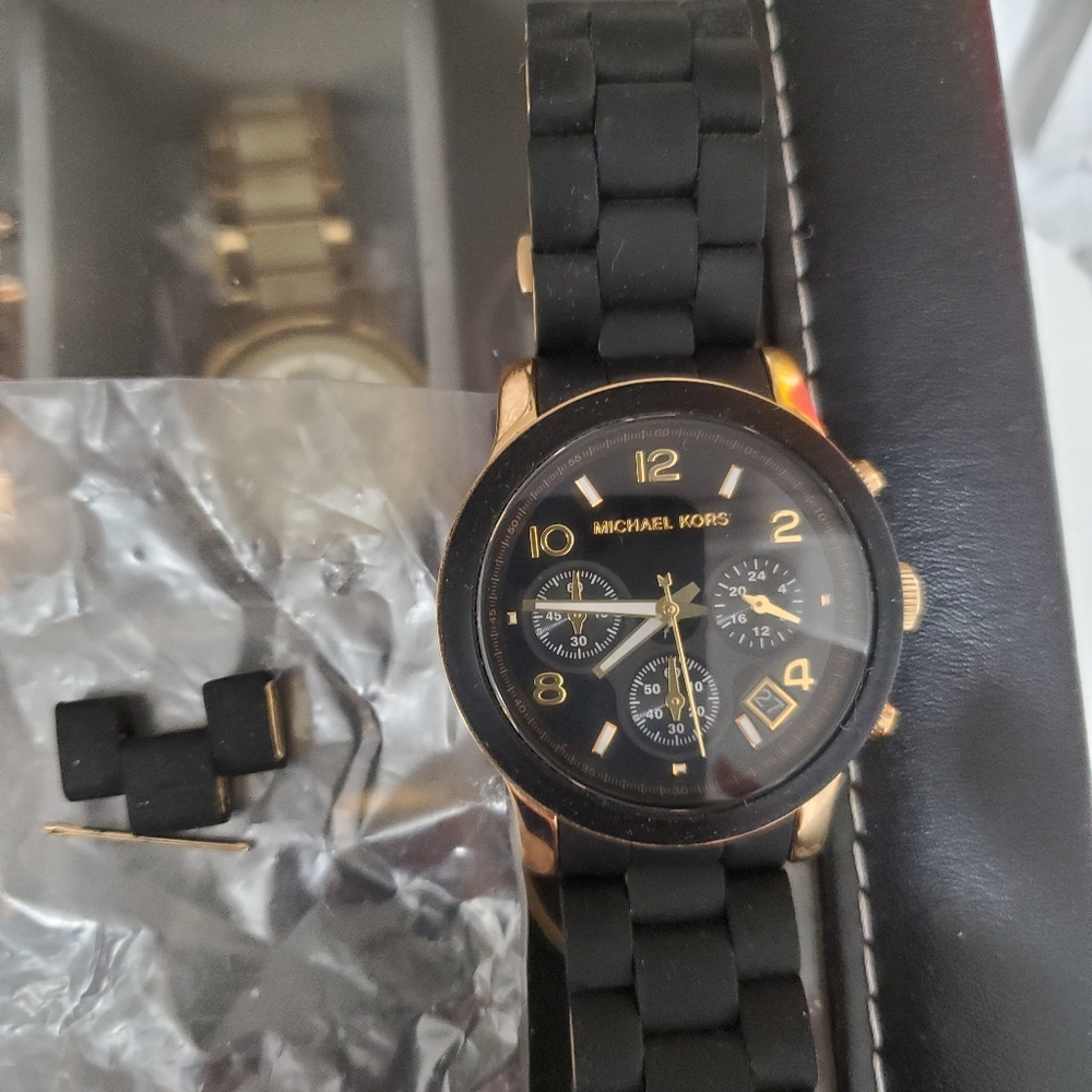 Michael Kors black and gold rubber material